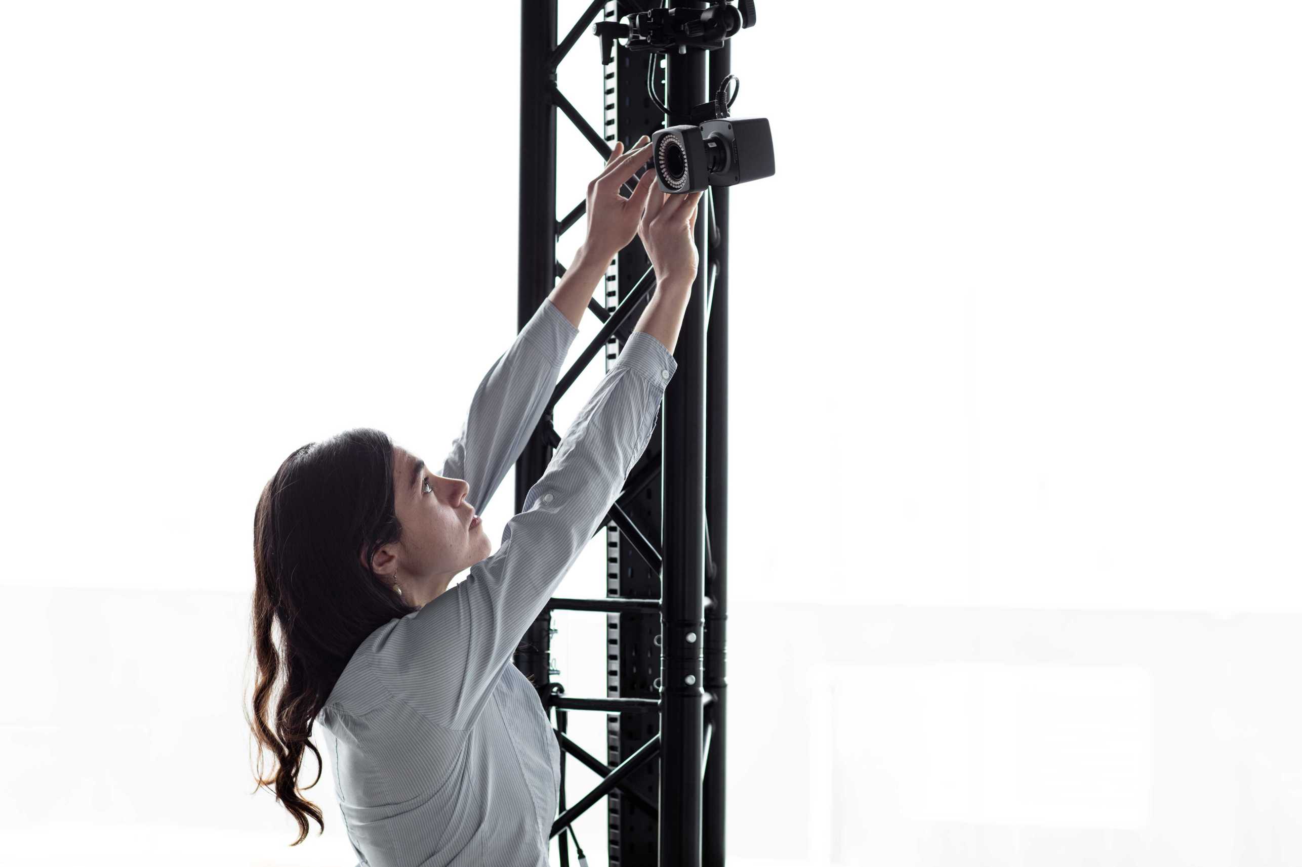 Enlarged view: Mathilde adjusting a motion capture camera