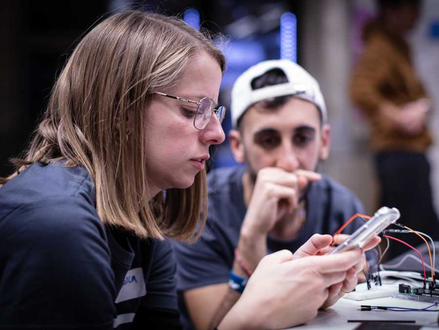 Enlarged view: Hackahealth 2022 Jessica Gantenbein looking at electronic Part
