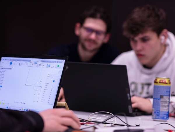 Enlarged view: Participants in the hackathon working on CAD