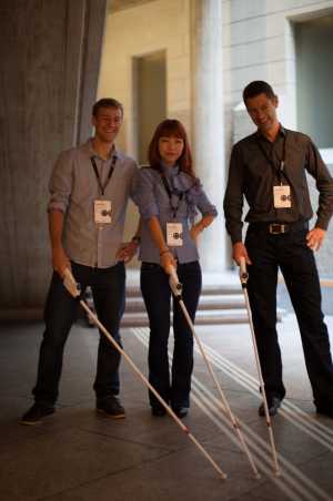 Enlarged view: Researcher in three musketeers pose with blind cane